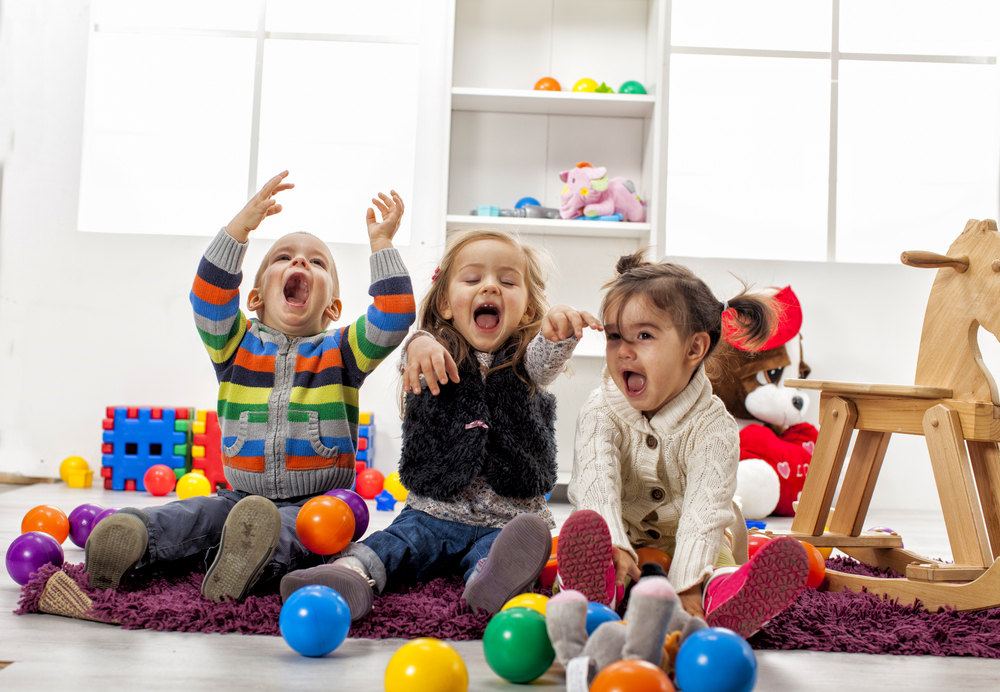 Happy children playing at nursery