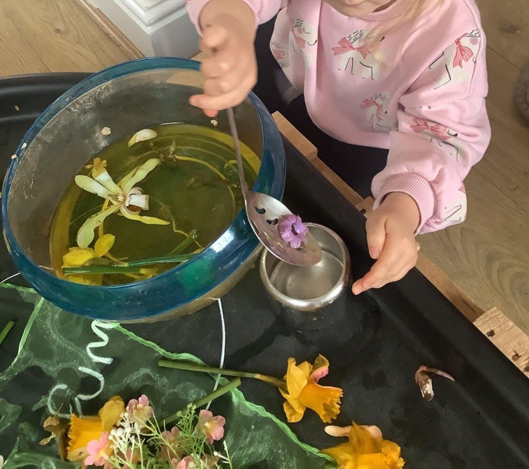 Children making flower potions