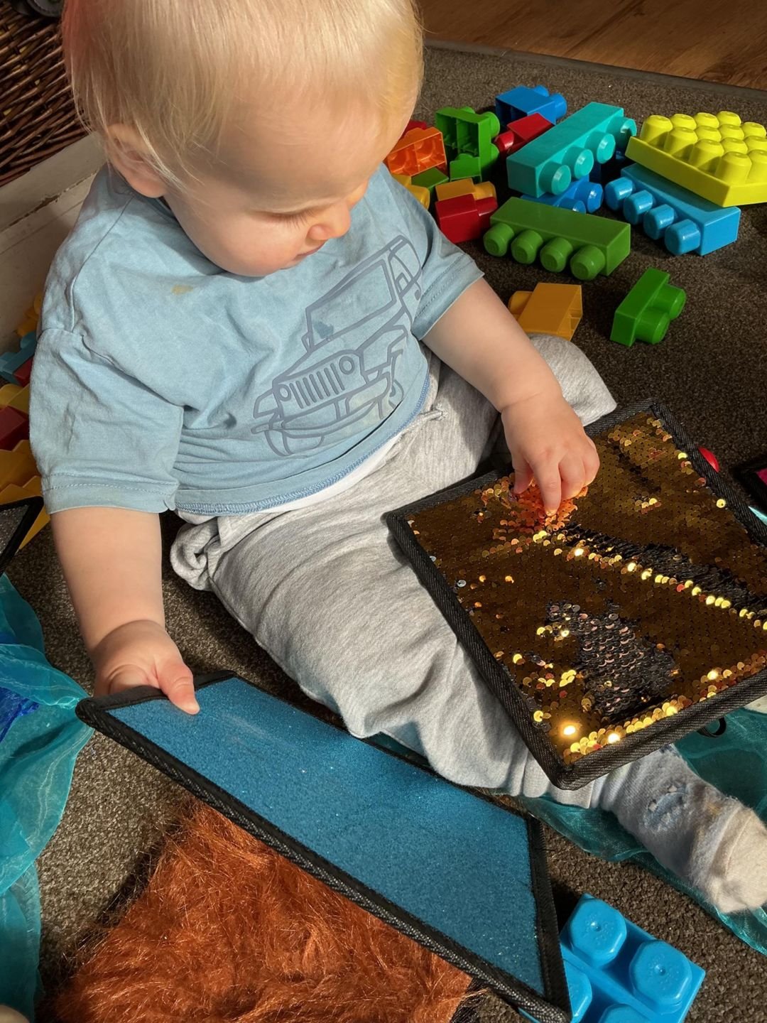 A baby exploring a sensory mat